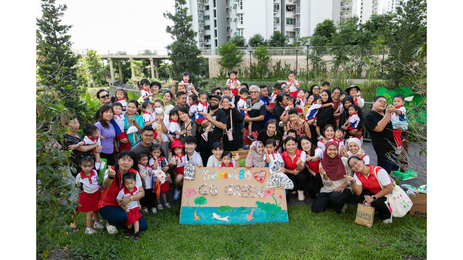 group picture with kindergardeners from PCF Sparkletots with their parents and children